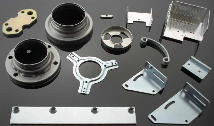 High-speed press machine stamping metal parts in a production line